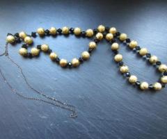 Collier sautoir noir et doré